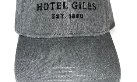 Charcoal fabric adjustable cap with black embroidered Hotel Giles logo